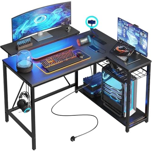 Bestier 106.5CM L-Shaped Gaming Desk with RGB LED Lights Carbon Fibre Surface, 3 Power Outlets & 2 USB Ports, Reversible Corner Desk with Shelves & Hooks for Home Office & Small Spaces